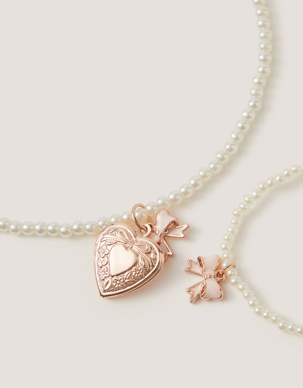 SET AKSESOARA - PEARL BOW LOCKET AND BLET